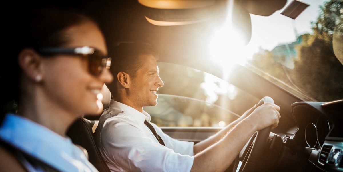 two people commuting in a car