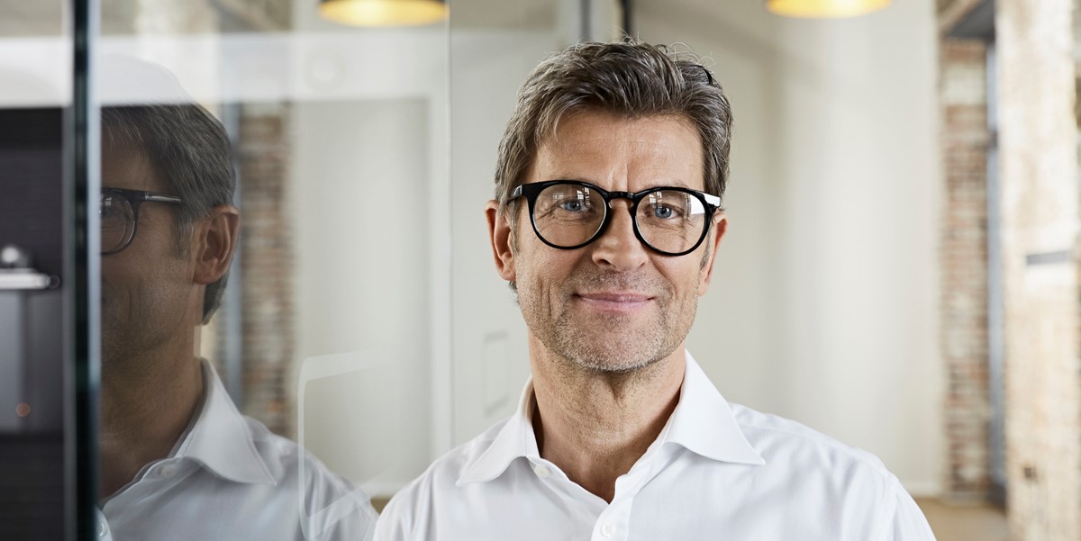 man smiling, in the office